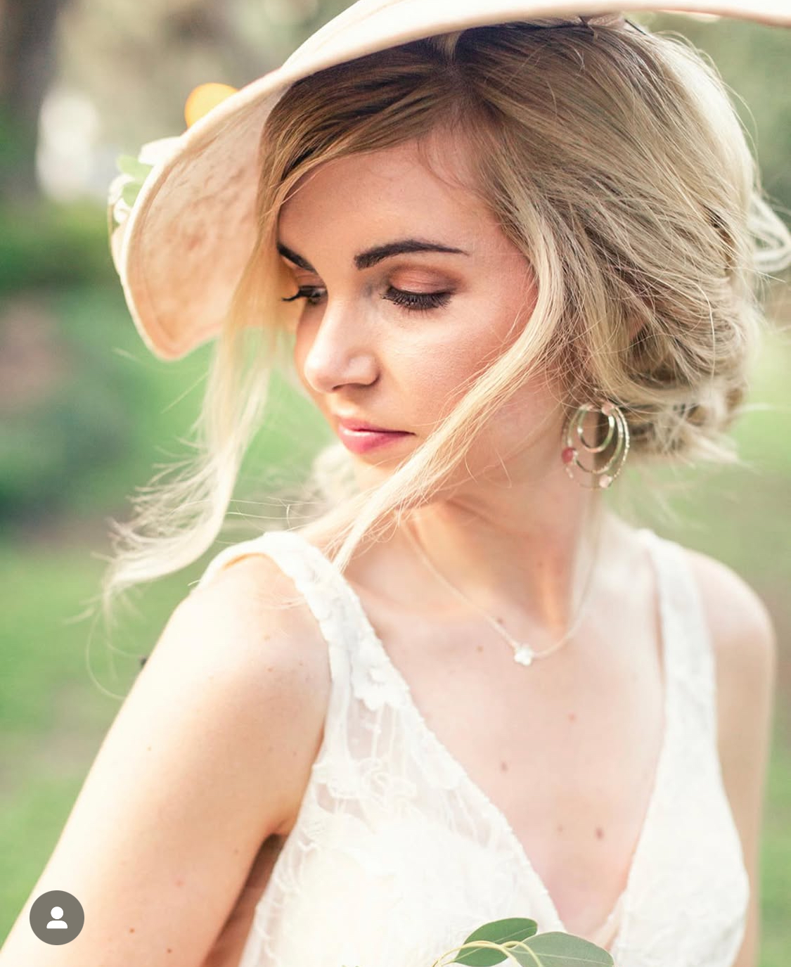 Soft bridal portrait in sculptural hat