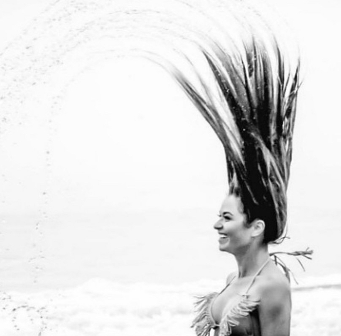 Black and white hair-flip on the shore